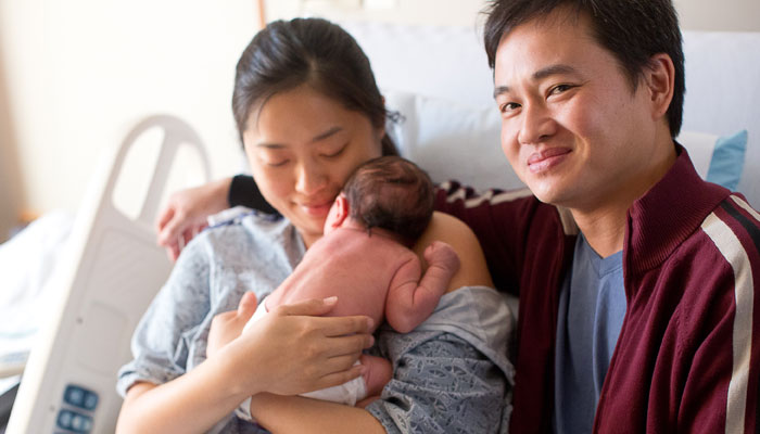 New Parents with Their Baby
