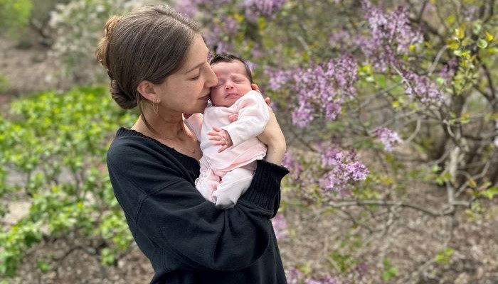 mom holding baby in her arms
