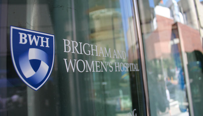 The Brigham and Women&rsquo;s Hospital logo shield on a window in the Longwood Medical Area, Boston, MA. 