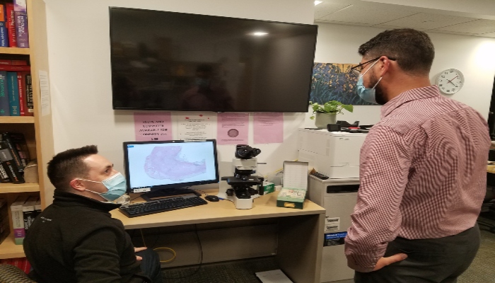 two residents looking at monitor