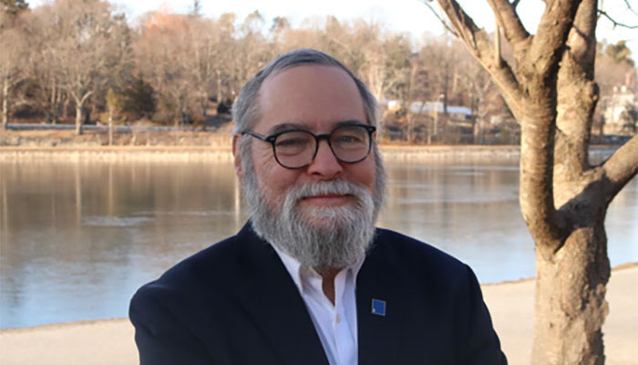 Jesse Hefter standing by a body of water