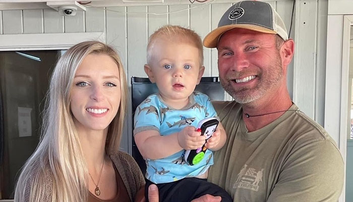 Michael King, pictured with wife Julia and their son, Cole