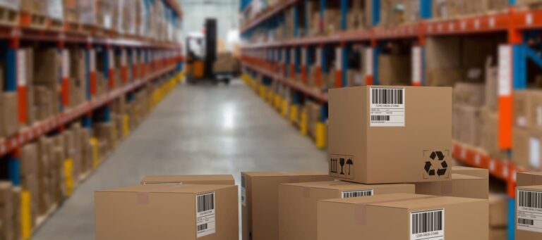 Omni-channel fulfillment warehouse with staff managing real-time inventory tracking across all sales channels