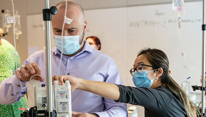 Nursing students working together in a lab