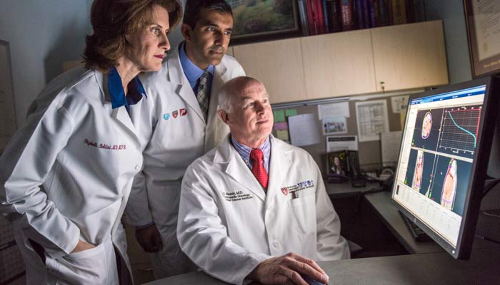 Bone and joint disease specialists from Brigham and Women&rsquo;s Hospital look at test results.