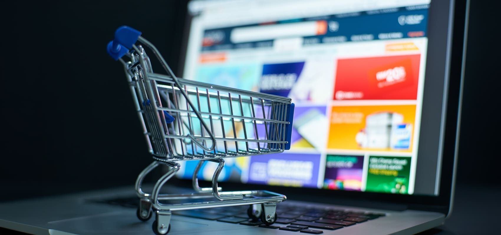 Visual of digital shopping experience with cart on laptop, representing Gen Z’s role in driving online retail trends.