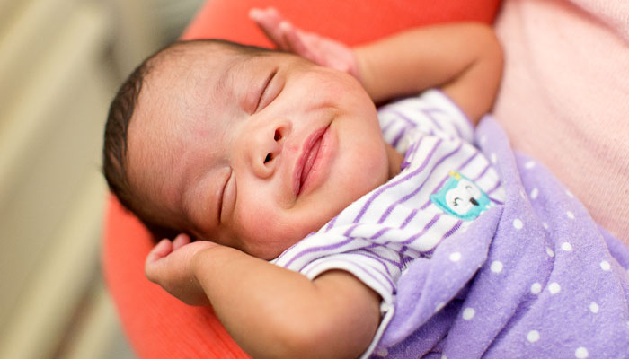 Smiling Newborn Baby