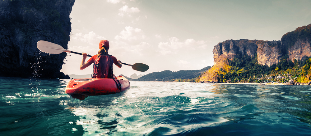 woman kayaking in the ocean