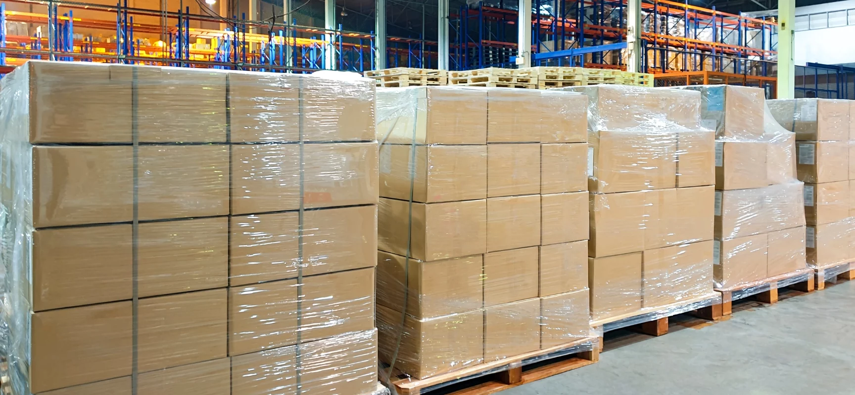 Organized ecommerce warehouse with rows of shelving and packages ready for shipment